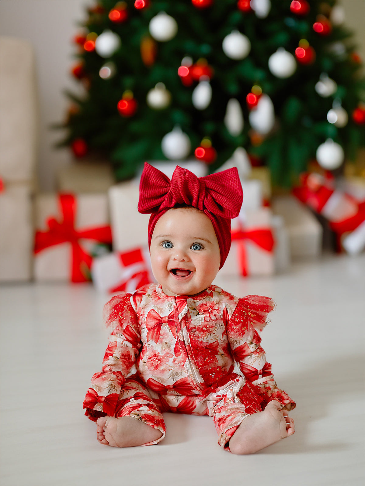 Red and white All I Wish double-zip footed newborn onesie with convertible mittens and tulle detailing