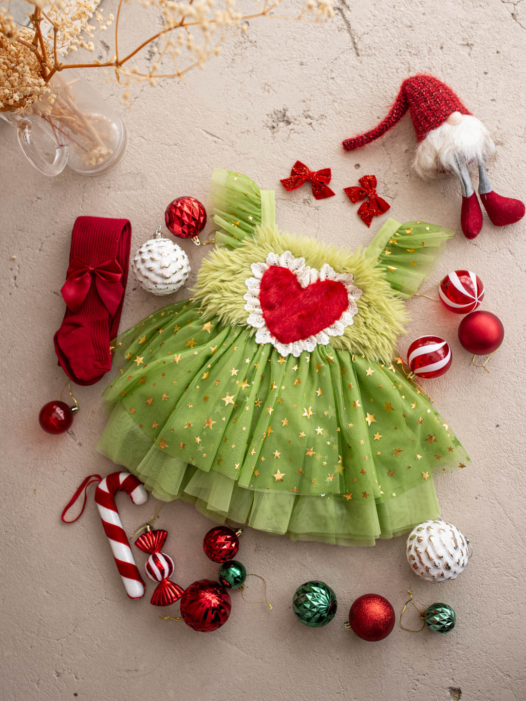 Miss Grump green tulle Christmas dress with a red fur heart, styled with red baubles, a candy cane and a Santa gnome - Before & Ever Kids