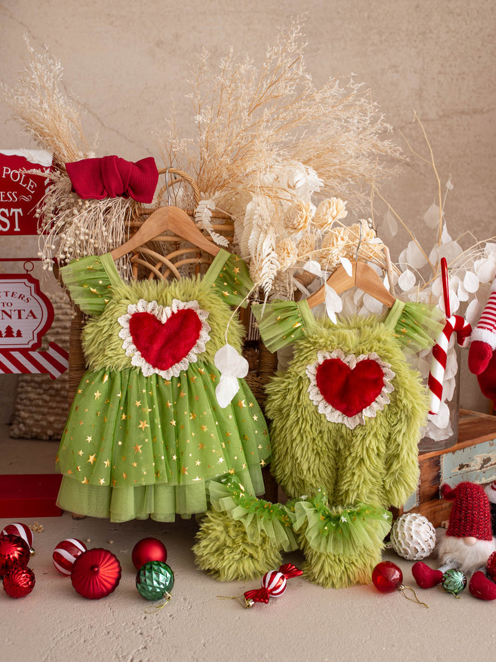 Miss Grump green tulle dress and Little Grump faux-fur romper on hangers together, a matching Christmas look for sisters - Before & Ever Kids