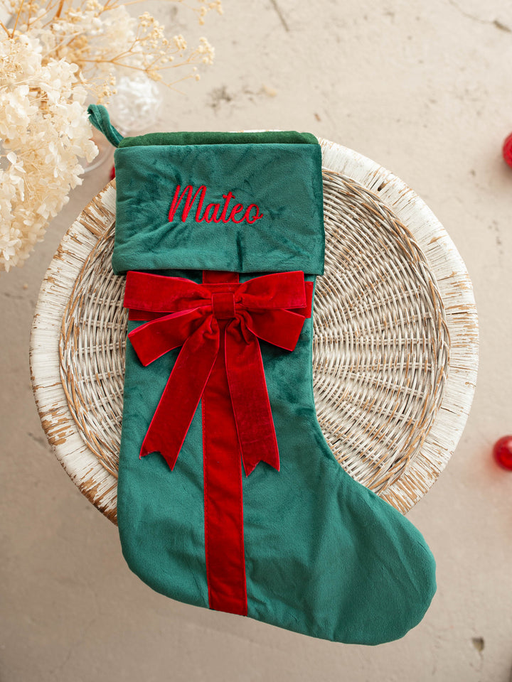 All Wrapped Up personalised Christmas stocking, green velvet with a red ribbon and bow, name embroidered on the cuff - Before & Ever Kids