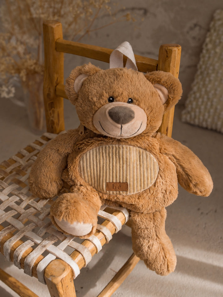 Beau the Bear plush backpack for kids, plush bear sidekick backpack sitting on a chair - Before & Ever Kids