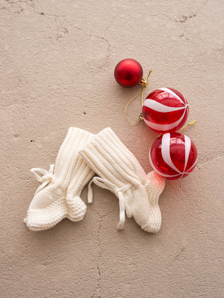 Bliss Knitted Booties in milk cotton knit with ankle ties, the pair laid flat, showing the ankle ties - Before & Ever Kids