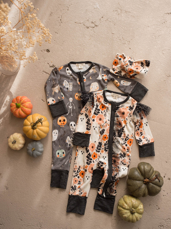 Boo Crew and Boo-quet Halloween baby onesies flat lay with matching floral topknot - Before & Ever Kids