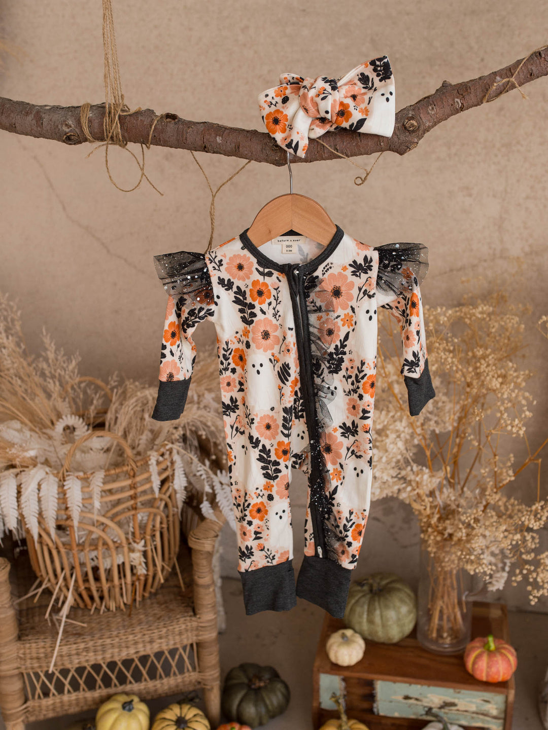 Boo-quet Halloween baby girl onesie hanging with its matching floral topknot headwrap - Before & Ever Kids
