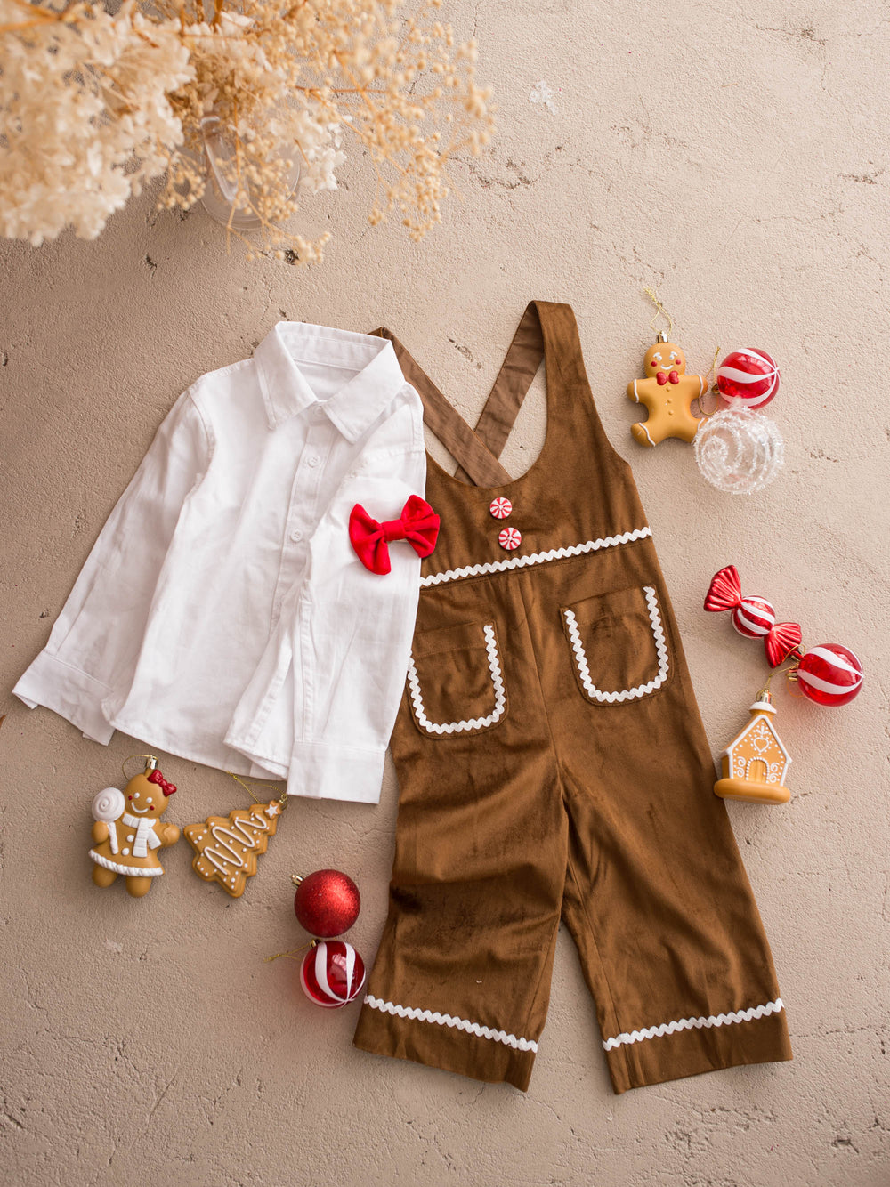 Catch Me If You Can caramel velvet boy overall, flat lay with the shirt, bow tie and gingerbread decorations - Before & Ever Kids