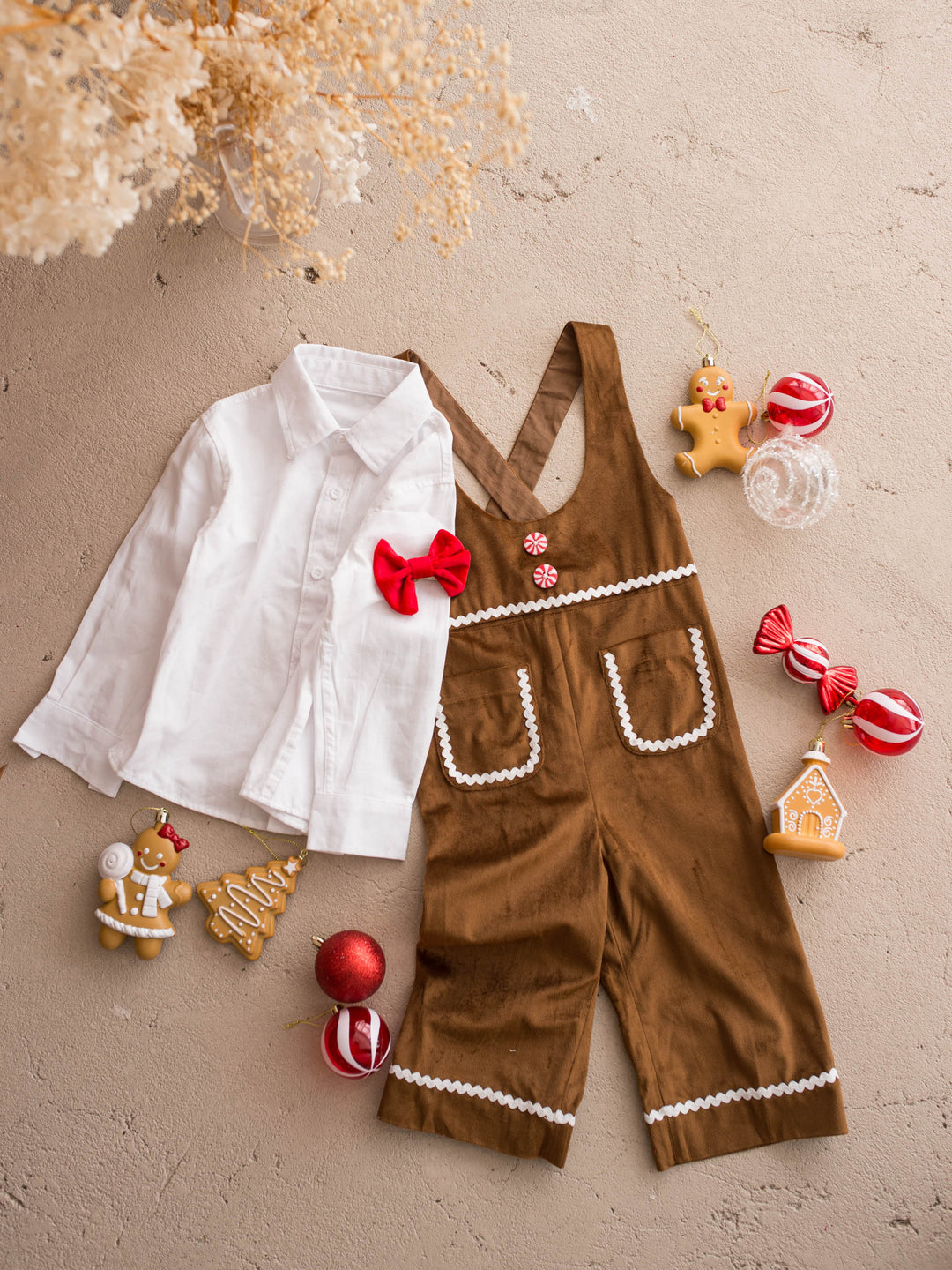 Catch Me If You Can caramel velvet boy overall, flat lay with the shirt, bow tie and gingerbread decorations - Before & Ever Kids