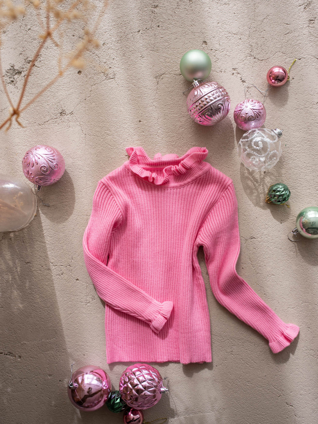 Claire Knitted Top bubblegum front view, bubblegum pink ribbed knit layering top with a ruffled neckline and cuffs - Before & Ever Kids