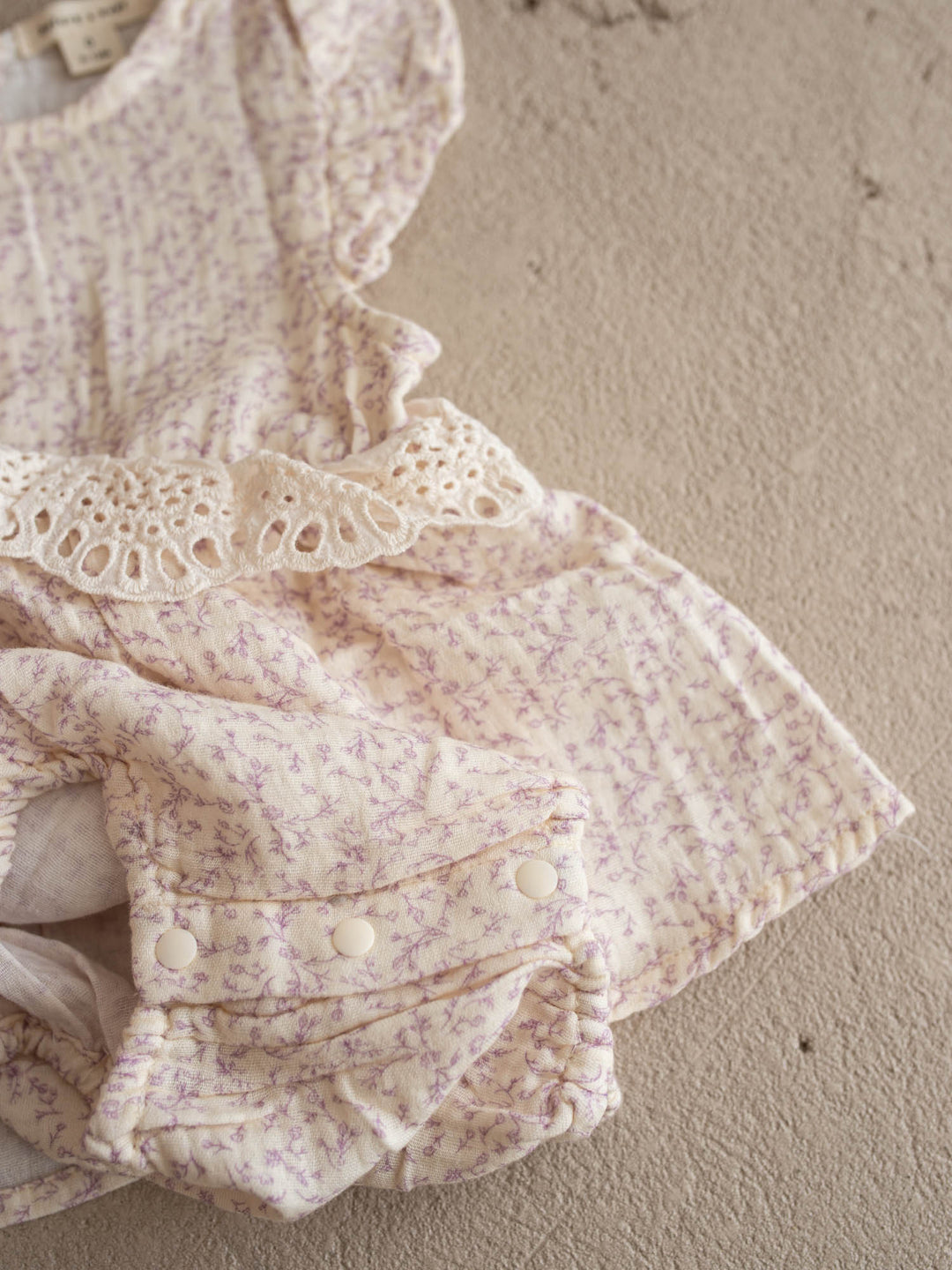 Dainty Miss Lavender Mae baby girl lavender floral cotton gauze romper with eyelet lace ruffle and flutter sleeves - Before & Ever Kids