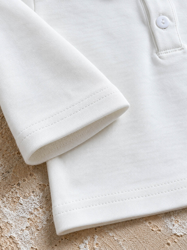 Everyday Cotton Polo, white long sleeve cotton polo, close up of the sleeve cuff and hem - Before & Ever Kids