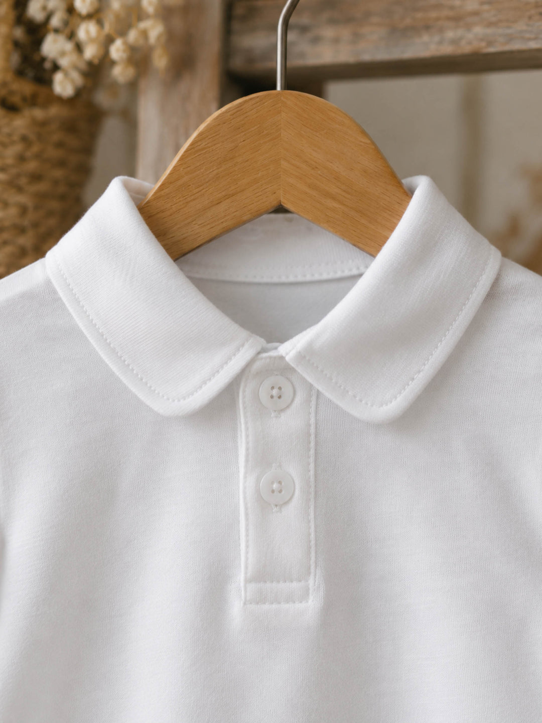 Everyday Cotton Polo, white short sleeve cotton polo, close up of the collar and buttons - Before & Ever Kids
