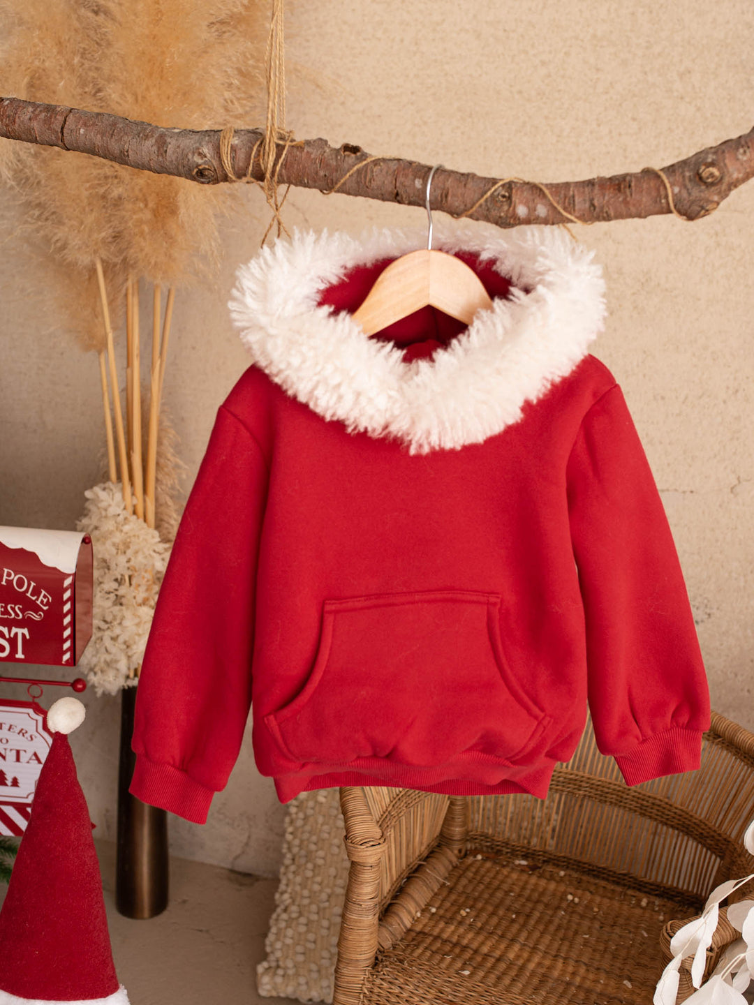 Ho Ho Hoodie red kids hoodie hanging on a branch, front - Before & Ever Kids