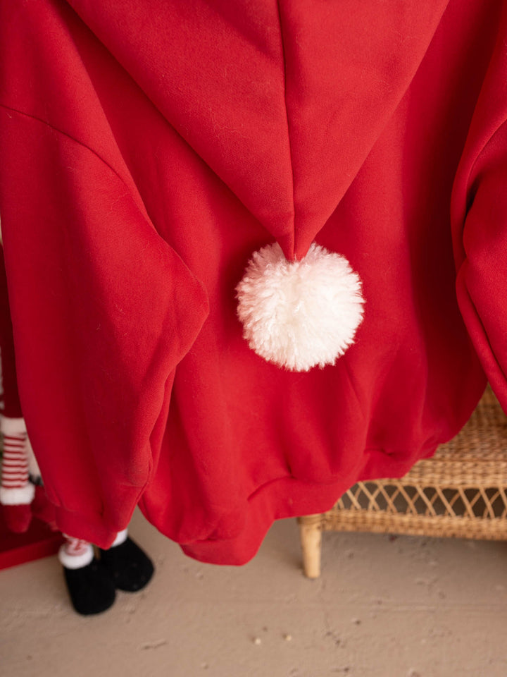 Close up of the white pom-pom on the Ho Ho Hoodie adult hood - Before & Ever Kids