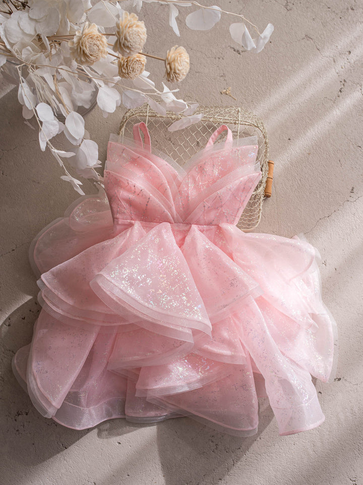 Little Good Witch pink glitter organza dress full dress styled on a chair - Before & Ever Kids