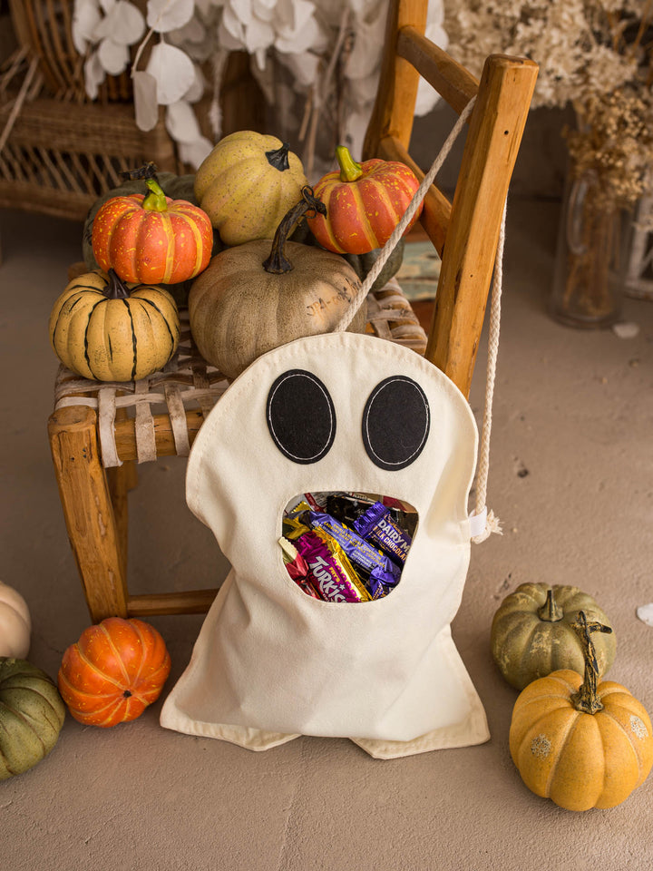 Little Gulp Ghost Treat Bag in cream, front view with rope strap and stitched felt eyes - Before & Ever Kids