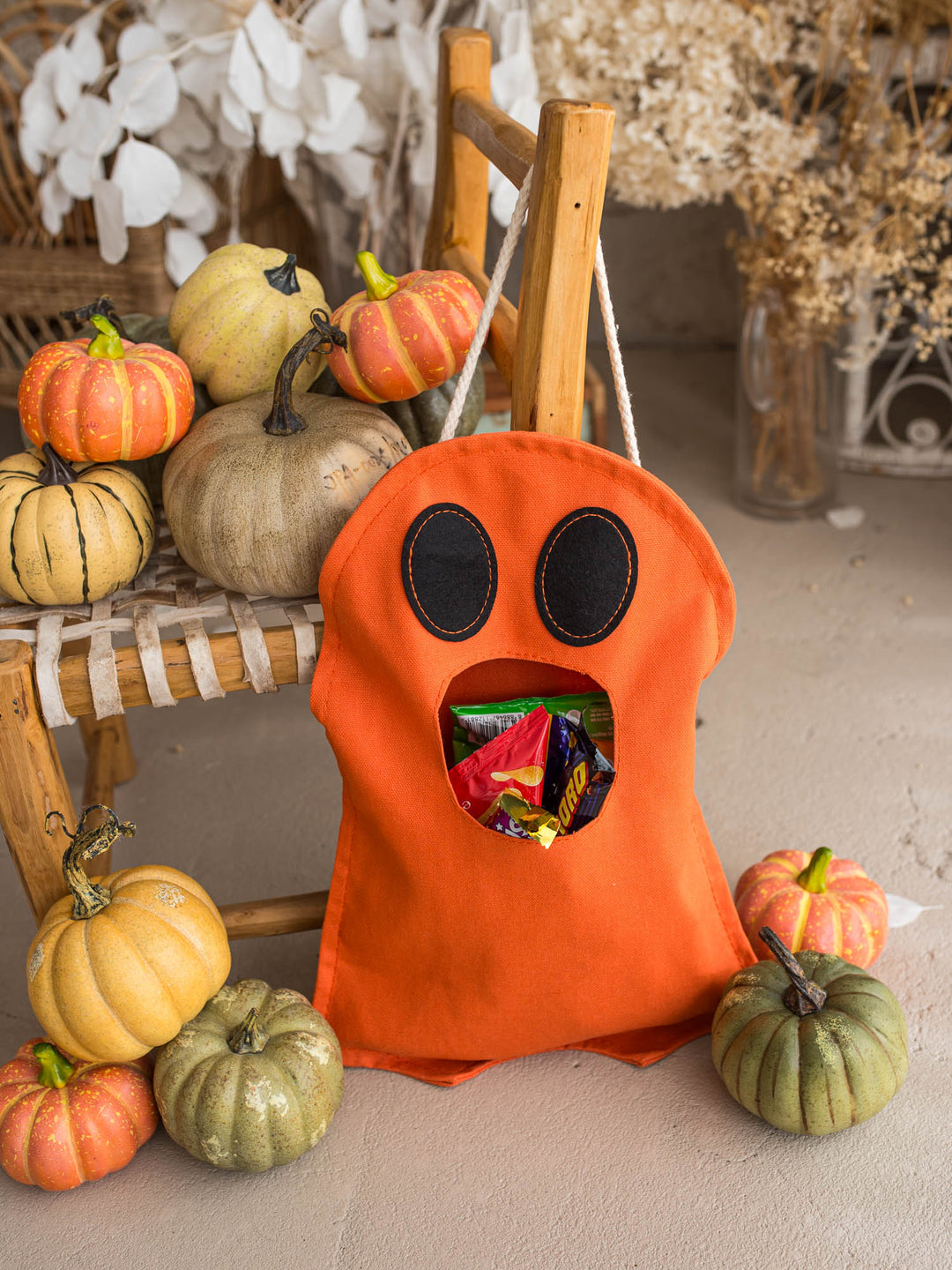 Little Gulp Ghost Treat Bag in orange, front view filled with sweets - Before & Ever Kids