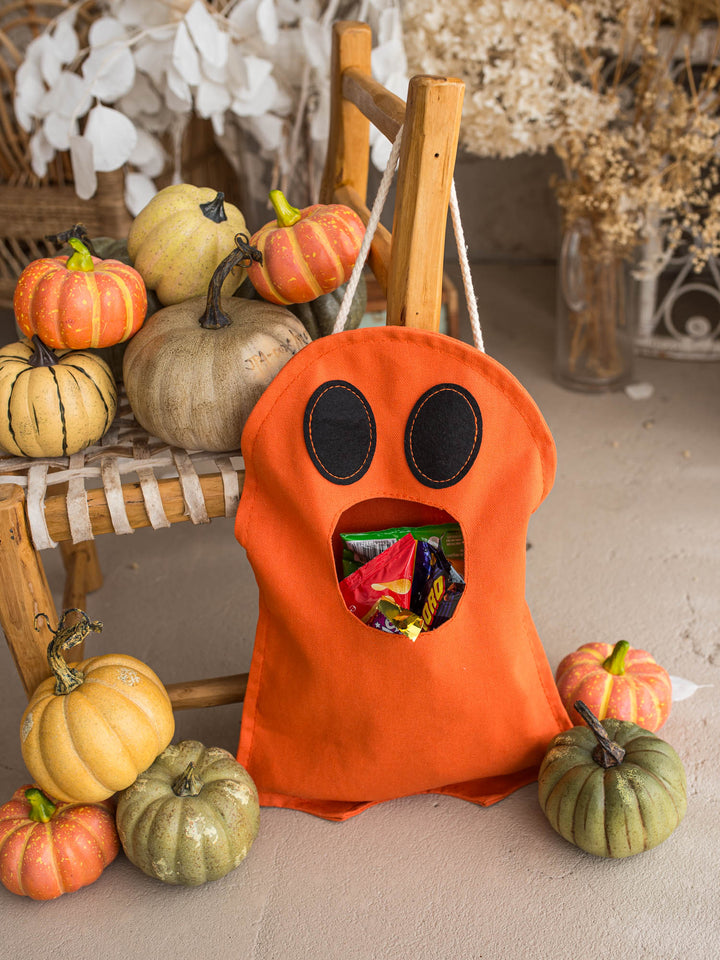 Little Gulp Ghost Treat Bag in orange, front view filled with sweets - Before & Ever Kids