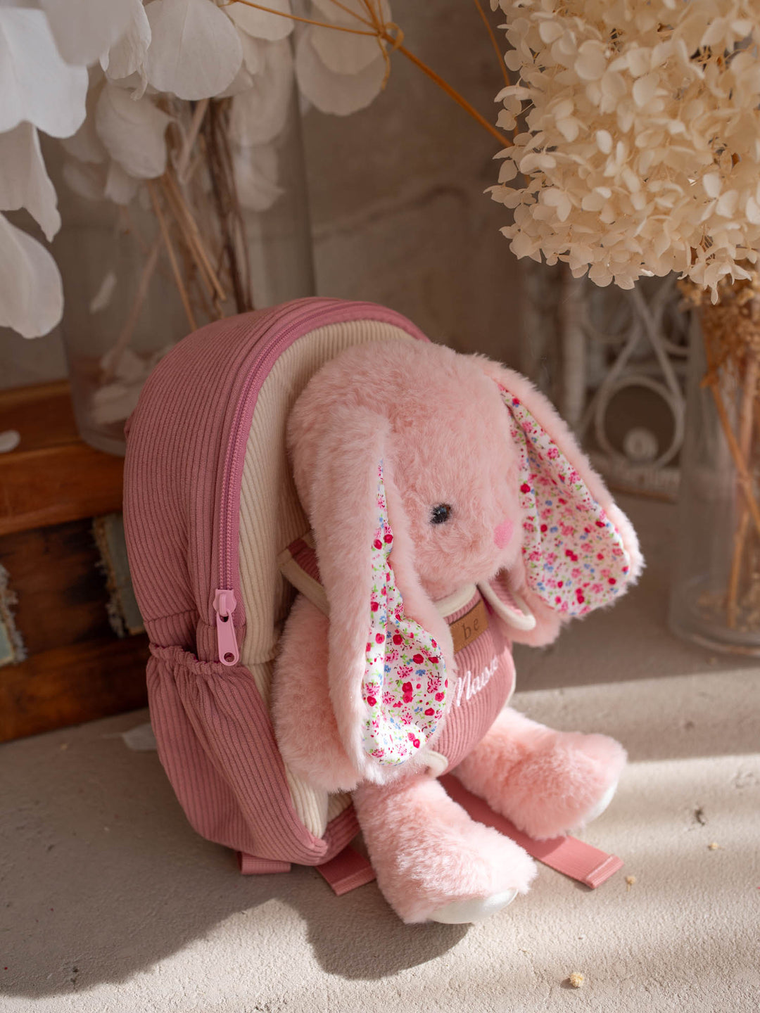 Macie the Bunny personalised Little BFF Companion Backpack, angled view showing the corduroy body and floral lined ears