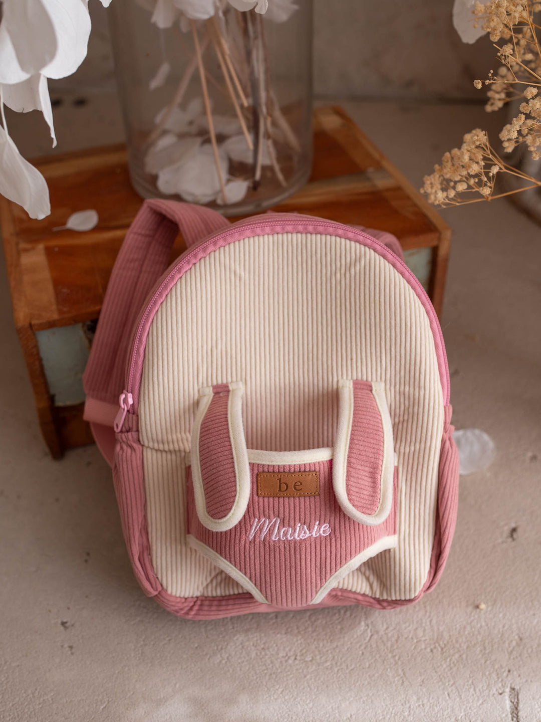Macie the Bunny personalised Little BFF Companion Backpack, front view with the embroidered name on the corduroy panel