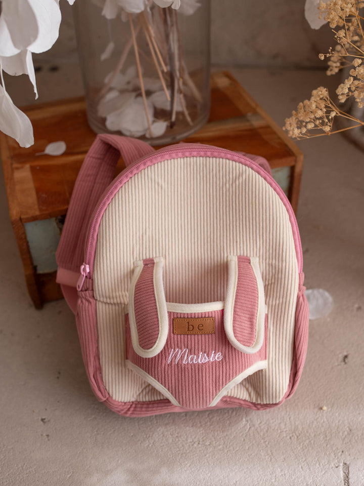 Macie the Bunny personalised Little BFF Companion Backpack, front view with the embroidered name on the corduroy panel