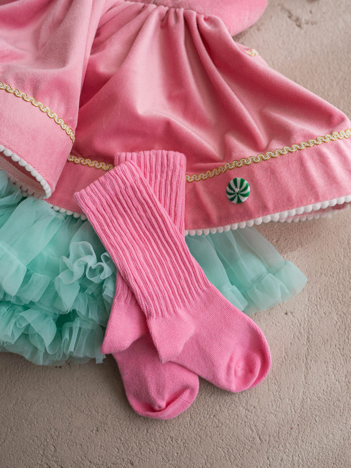 Bubblegum pink ribbed socks styled with a pink velvet dress and mint tulle skirt