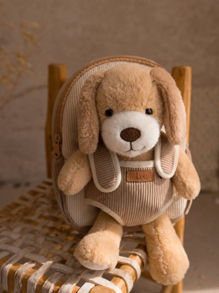 Milo the Puppy plush backpack for kids, front view with the plush puppy in the front pocket - Before & Ever Kids