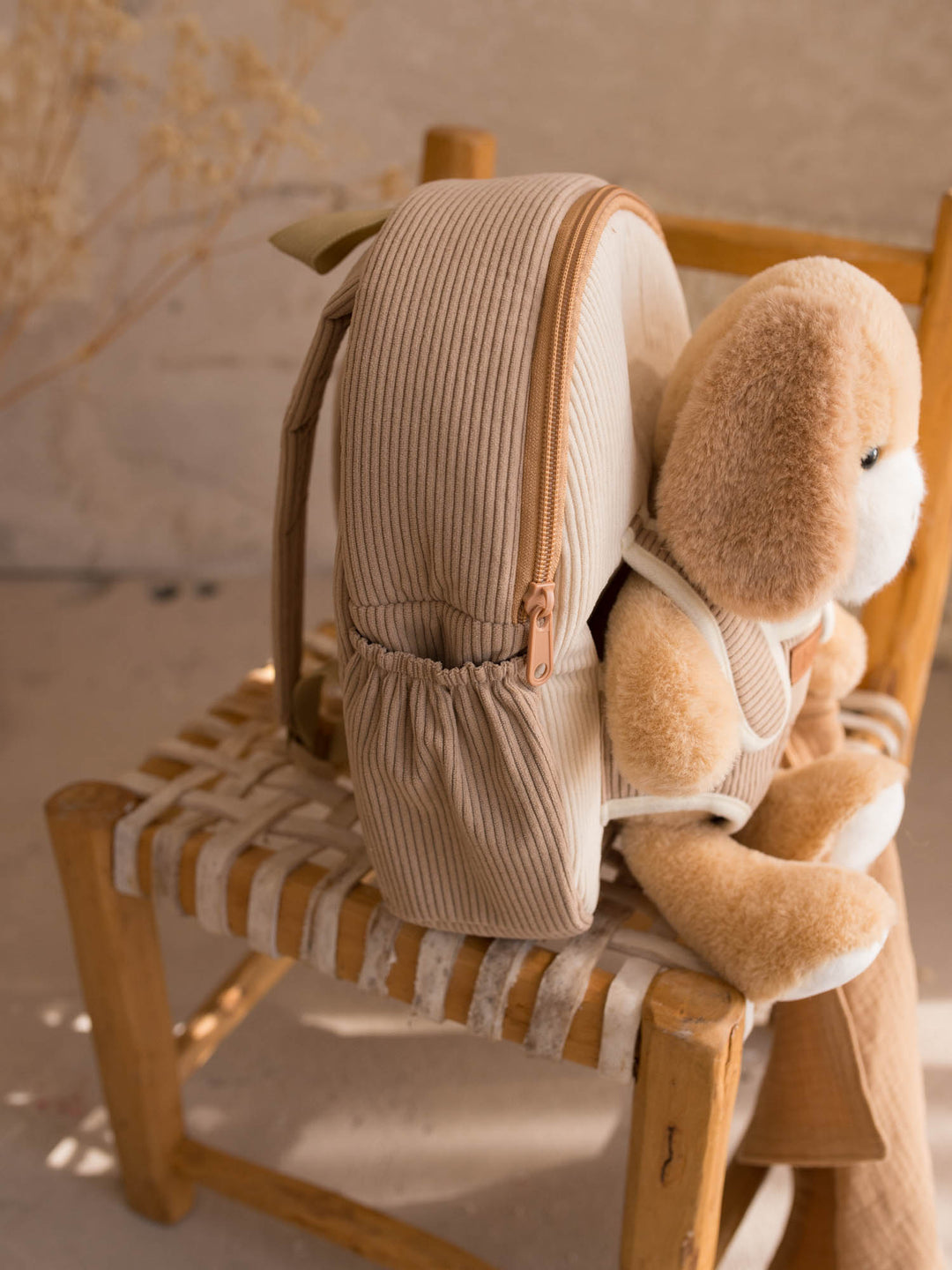 Milo the Puppy plush backpack for kids, side view of the backpack with the puppy - Before & Ever Kids