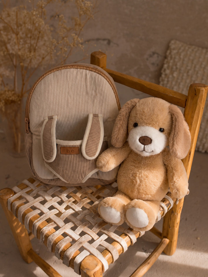 Milo the Puppy plush backpack for kids, backpack with the puppy sitting beside it - Before & Ever Kids