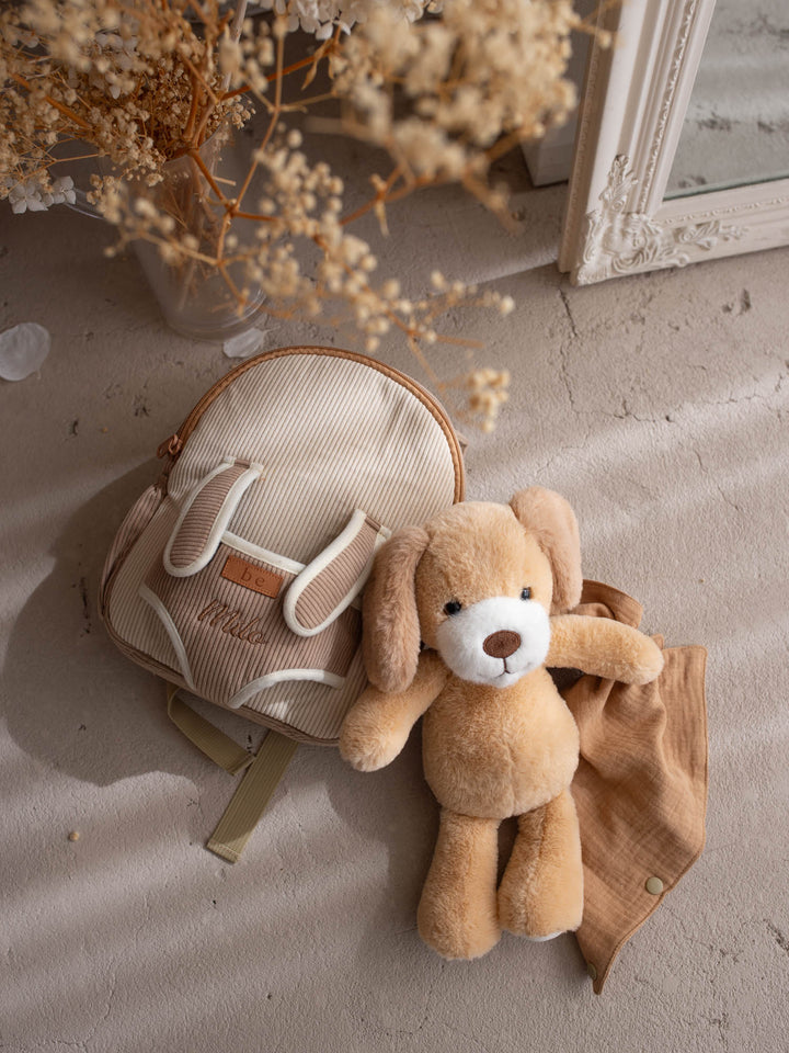 Milo the Puppy personalised Little BFF Companion Backpack, flat lay with the detachable plush and matching comforter