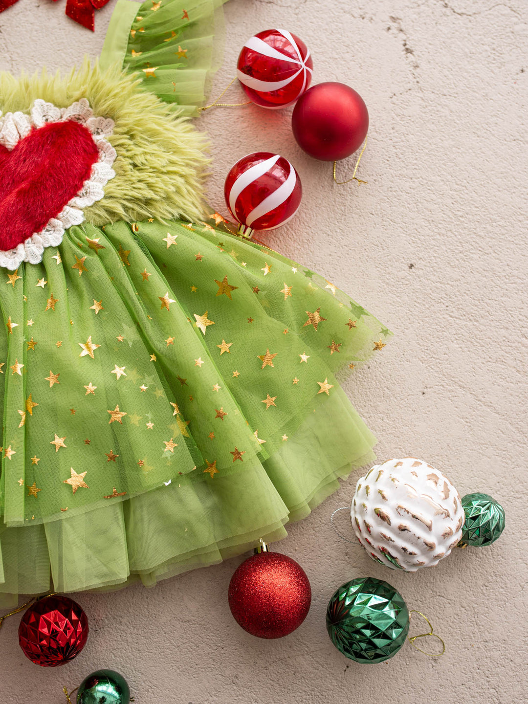 Gold star tulle skirt of the Miss Grump Christmas dress with red and green baubles - Before & Ever Kids