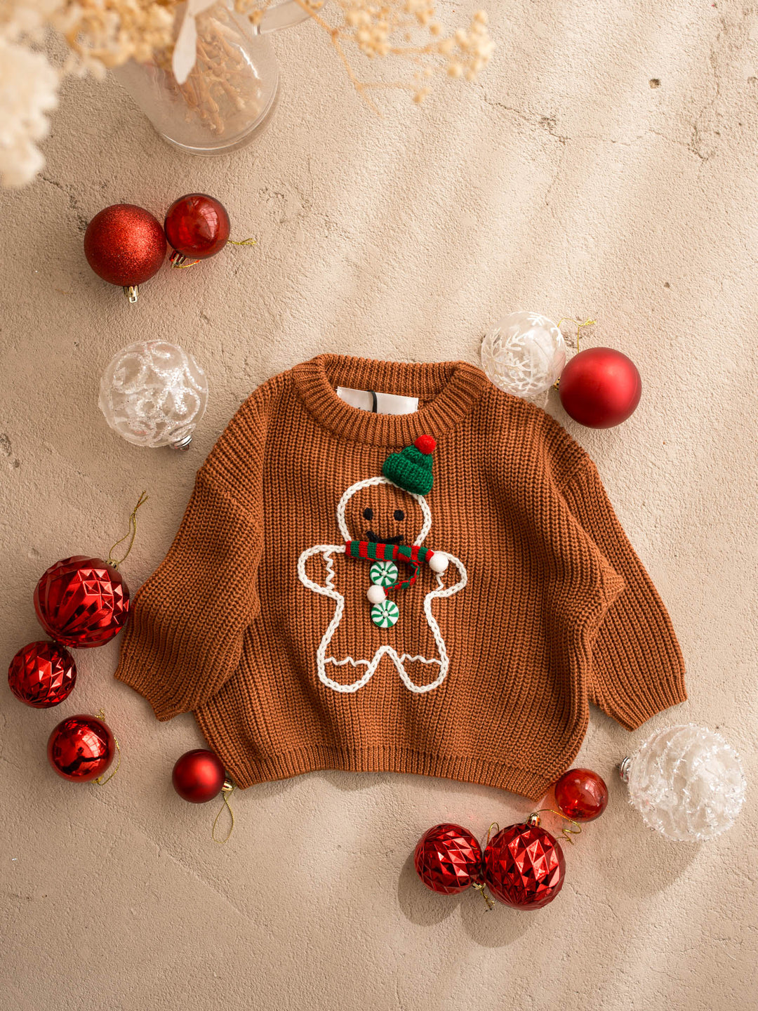 Mr Gingerbread Sweater brown front view, caramel chunky knit sweater with an embroidered gingerbread boy in a green beanie and striped scarf - Before & Ever Kids