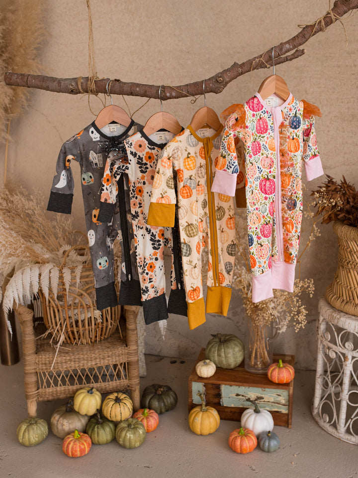 Halloween baby onesie collection, Patch Perfect, Patch Ready, Boo Crew and Boo-quet hanging together - Before & Ever Kids