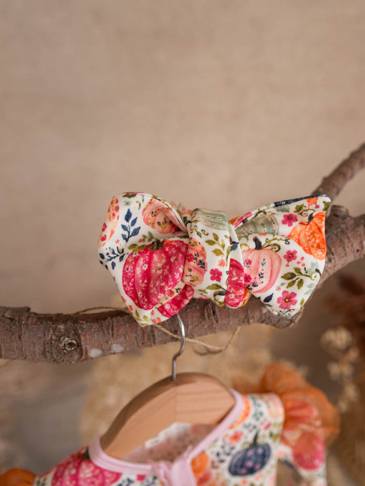 Patch Perfect pumpkin floral topknot headwrap above its matching baby onesie - Before & Ever Kids