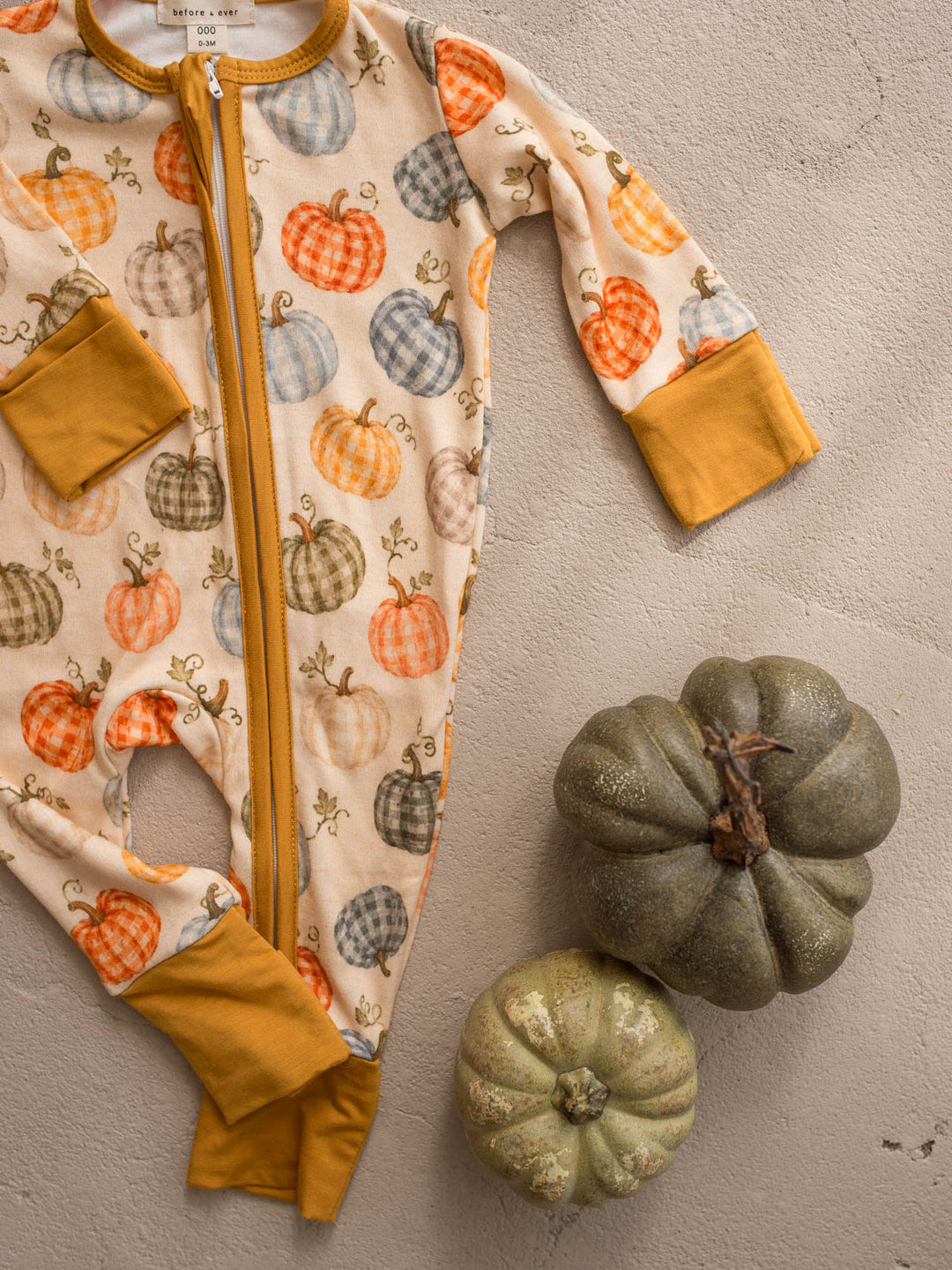 Patch Ready pumpkin onesie flat lay detail with mustard binding - Before & Ever Kids