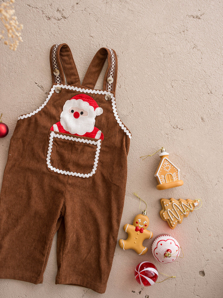 Peekaboo Overall in Santa, chocolate cotton corduroy overall with a Santa face pocket, flat with gingerbread cookies and baubles - Before & Ever Kids