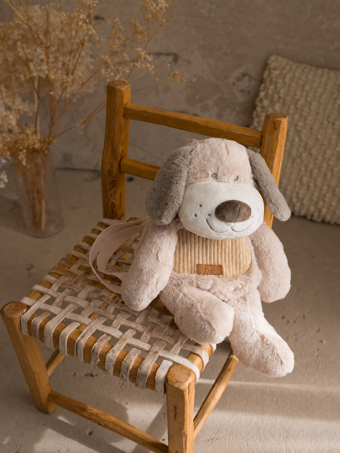 Pip the Puppy plush backpack for kids, plush puppy sidekick backpack sitting on a chair - Before & Ever Kids