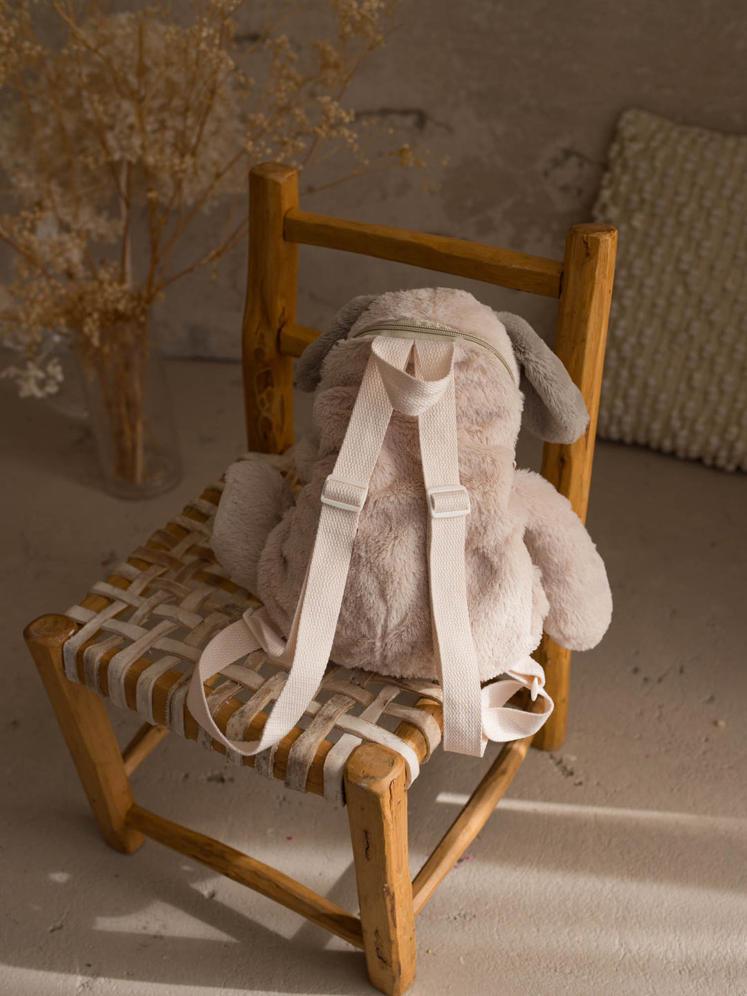 Pip the Puppy plush backpack for kids, back view showing the adjustable straps - Before & Ever Kids