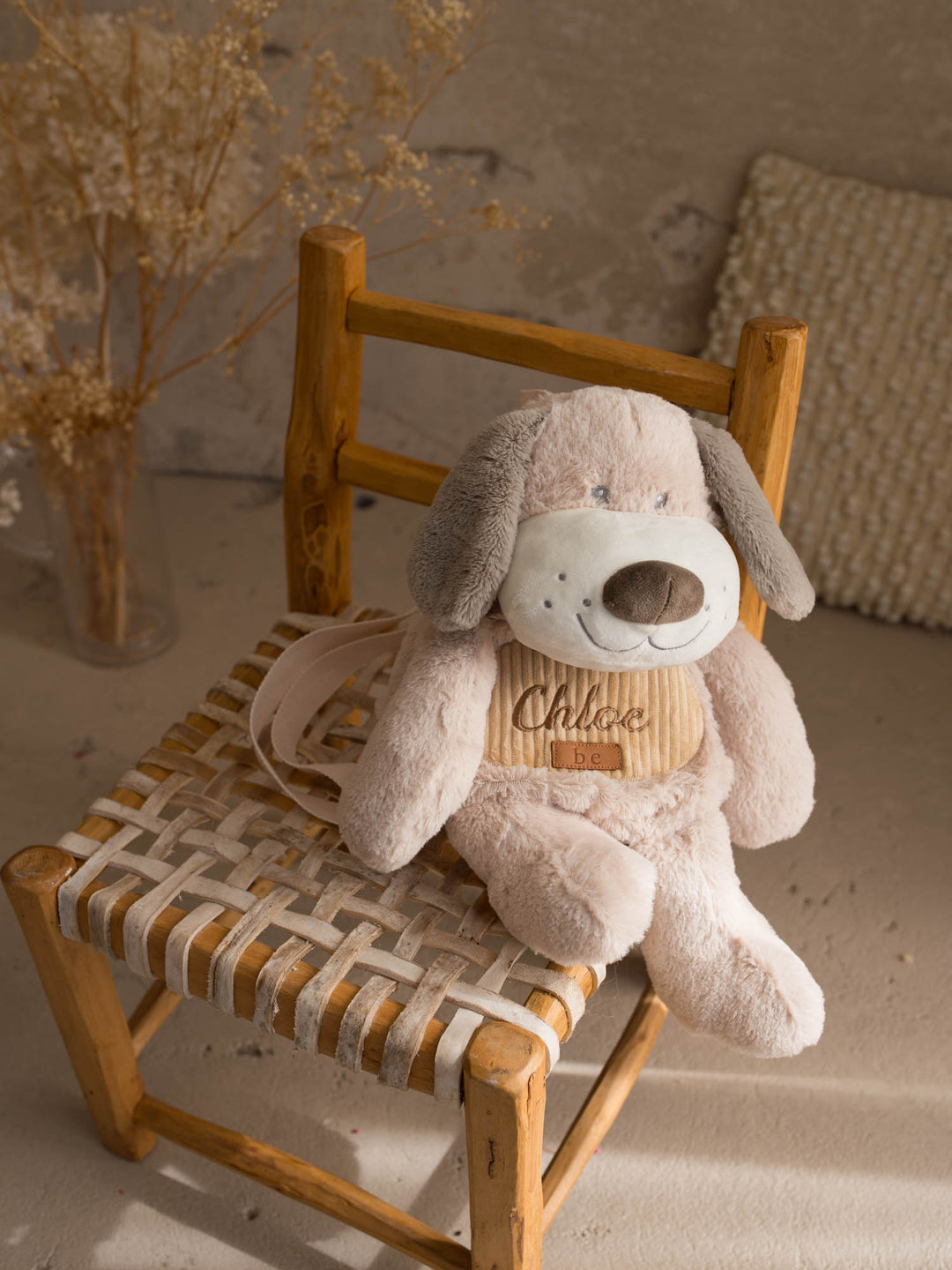 Pip the Puppy personalised plush backpack for kids, plush puppy sidekick backpack sitting on a chair - Before & Ever Kids