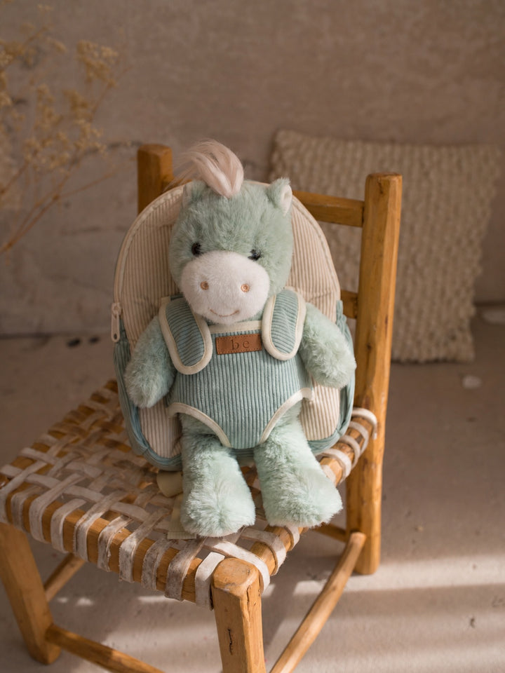 Sage the Horse plush backpack for kids, front view with the plush horse in the front pocket - Before & Ever Kids