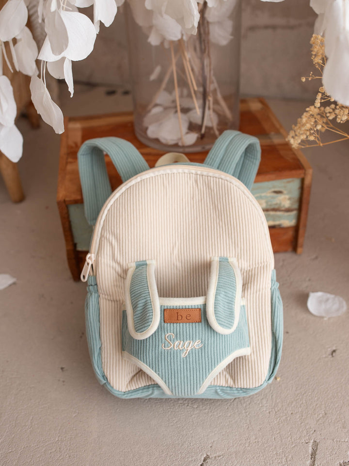 Sage the Horse personalised Little BFF Companion Backpack, front view with the embroidered name on the corduroy panel