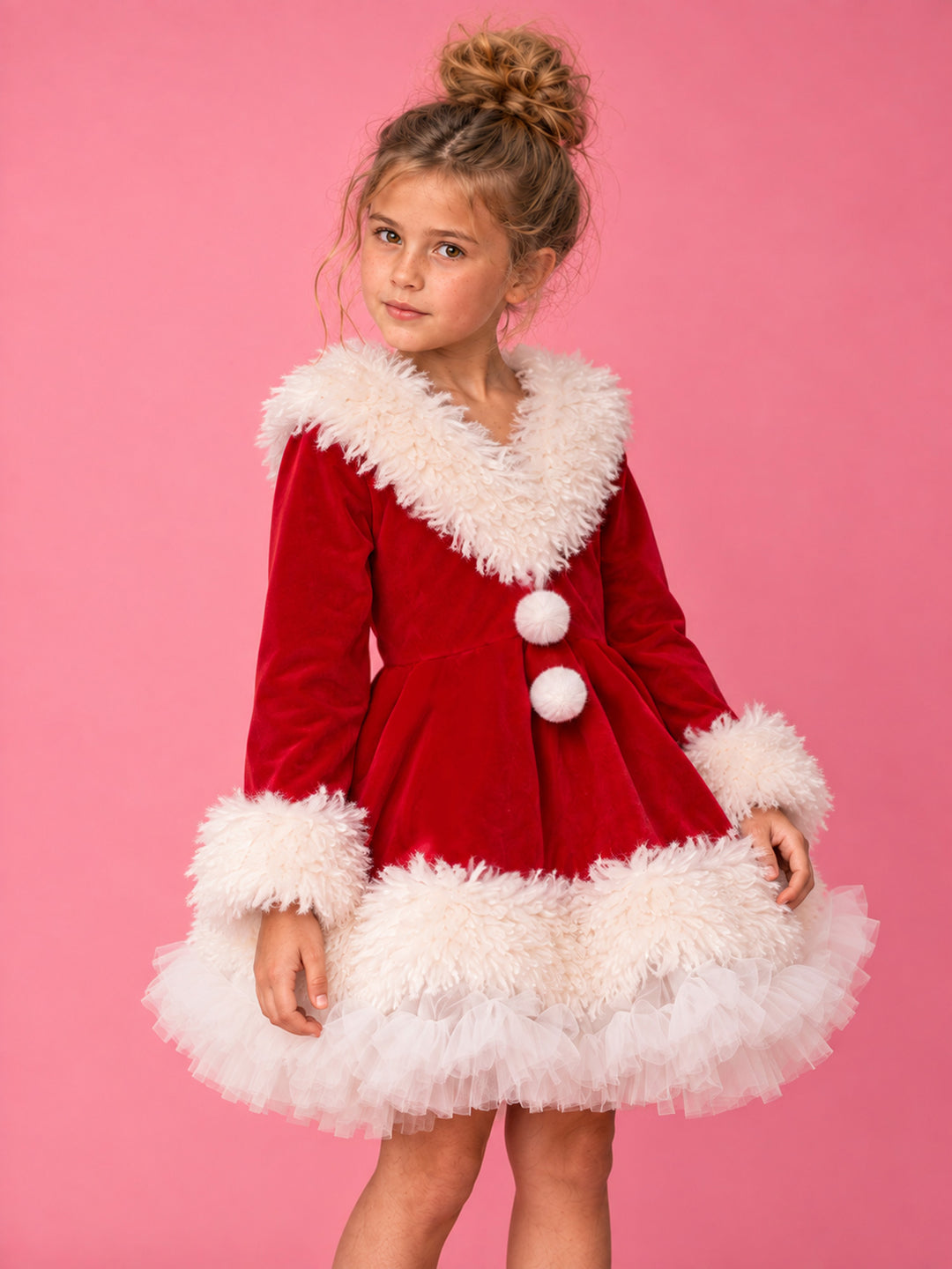 She Came to Sleigh red velvet Santa dress worn by a girl, close front view of the white fluffy collar, pom-poms and fur cuffs - Before & Ever Kids