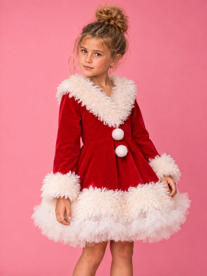 She Came to Sleigh red velvet Santa dress worn by a girl, close front view of the white fluffy collar, pom-poms and fur cuffs - Before & Ever Kids