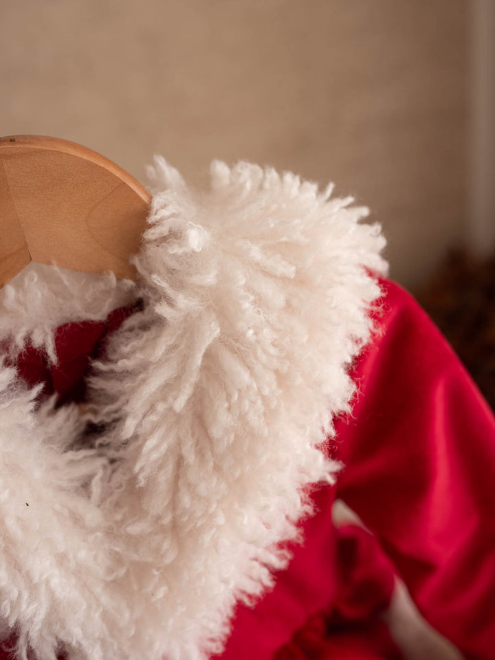 Close up of the white fluffy collar on the She Came to Sleigh red velvet dress - Before & Ever Kids