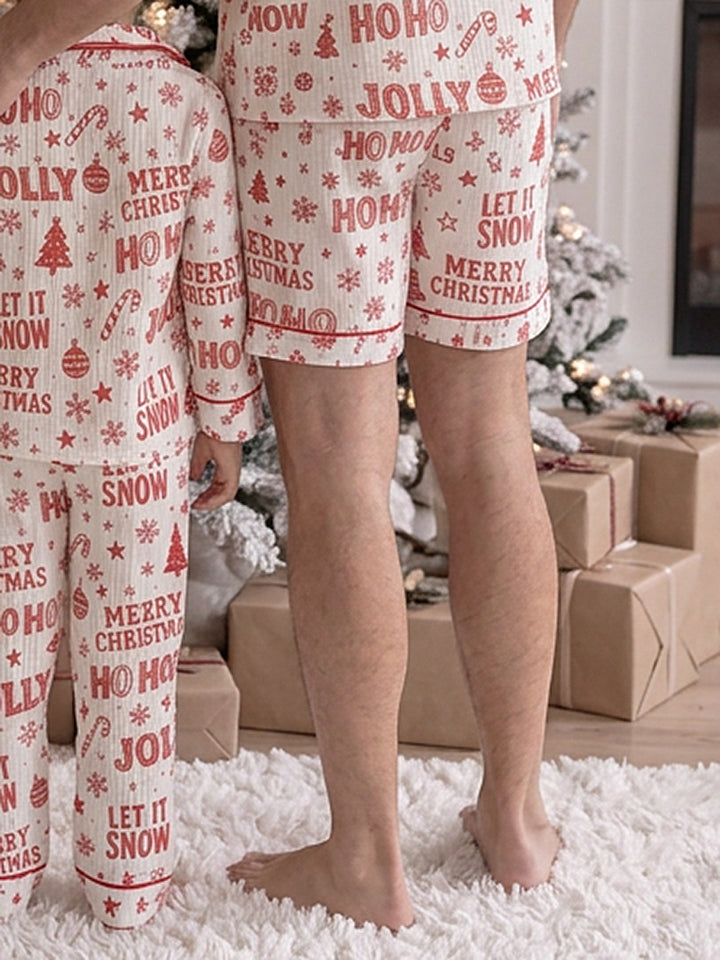 Twas the Night family Christmas pyjamas, white cotton muslin with a red Christmas print, close crop of dad's and the boy's shorts, front - Before & Ever Kids
