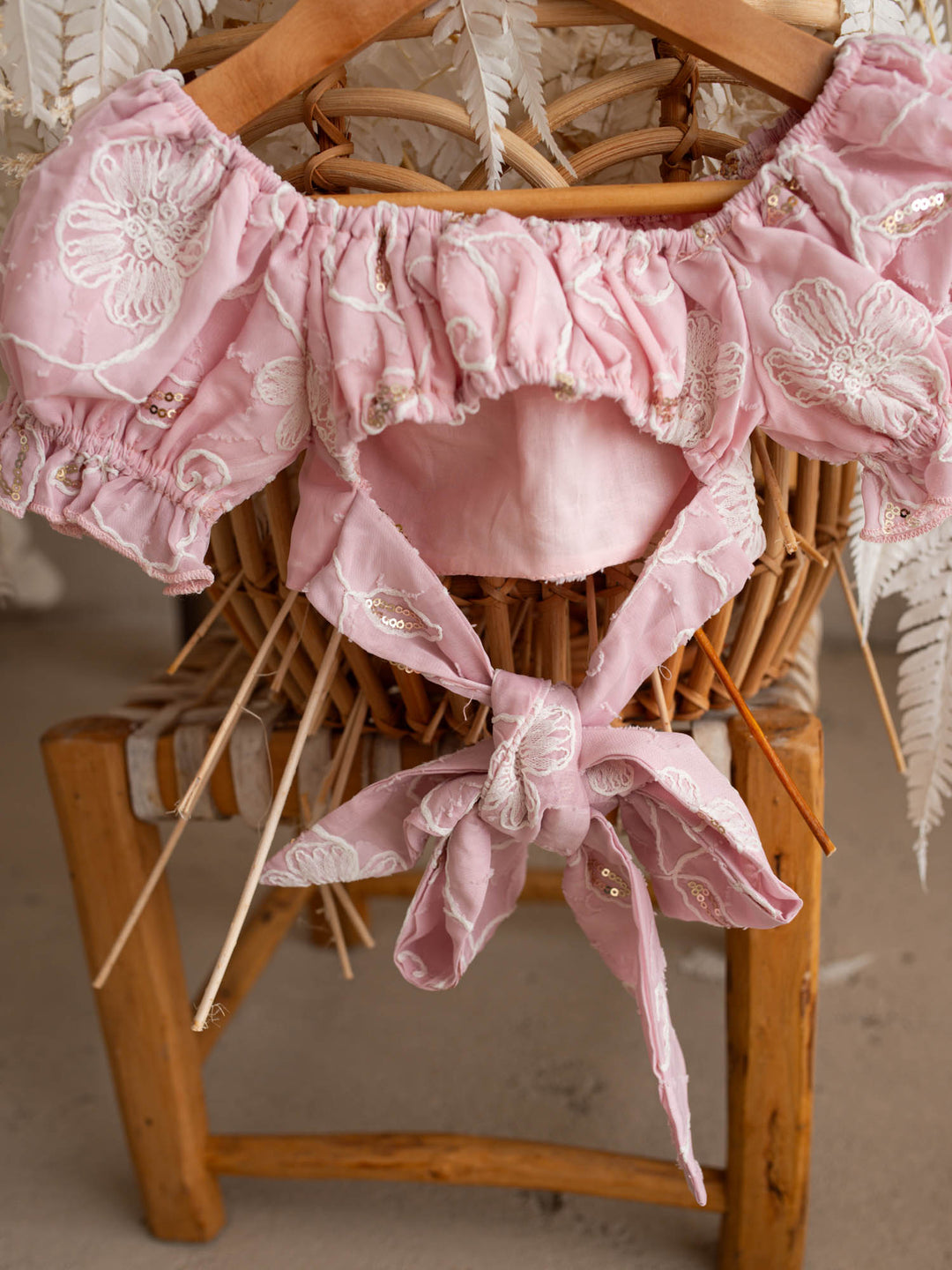 Where Summer Blooms baby pink baby girl set with white floral embroidery, gold sequins, puff sleeves and a bubble-hem skort.