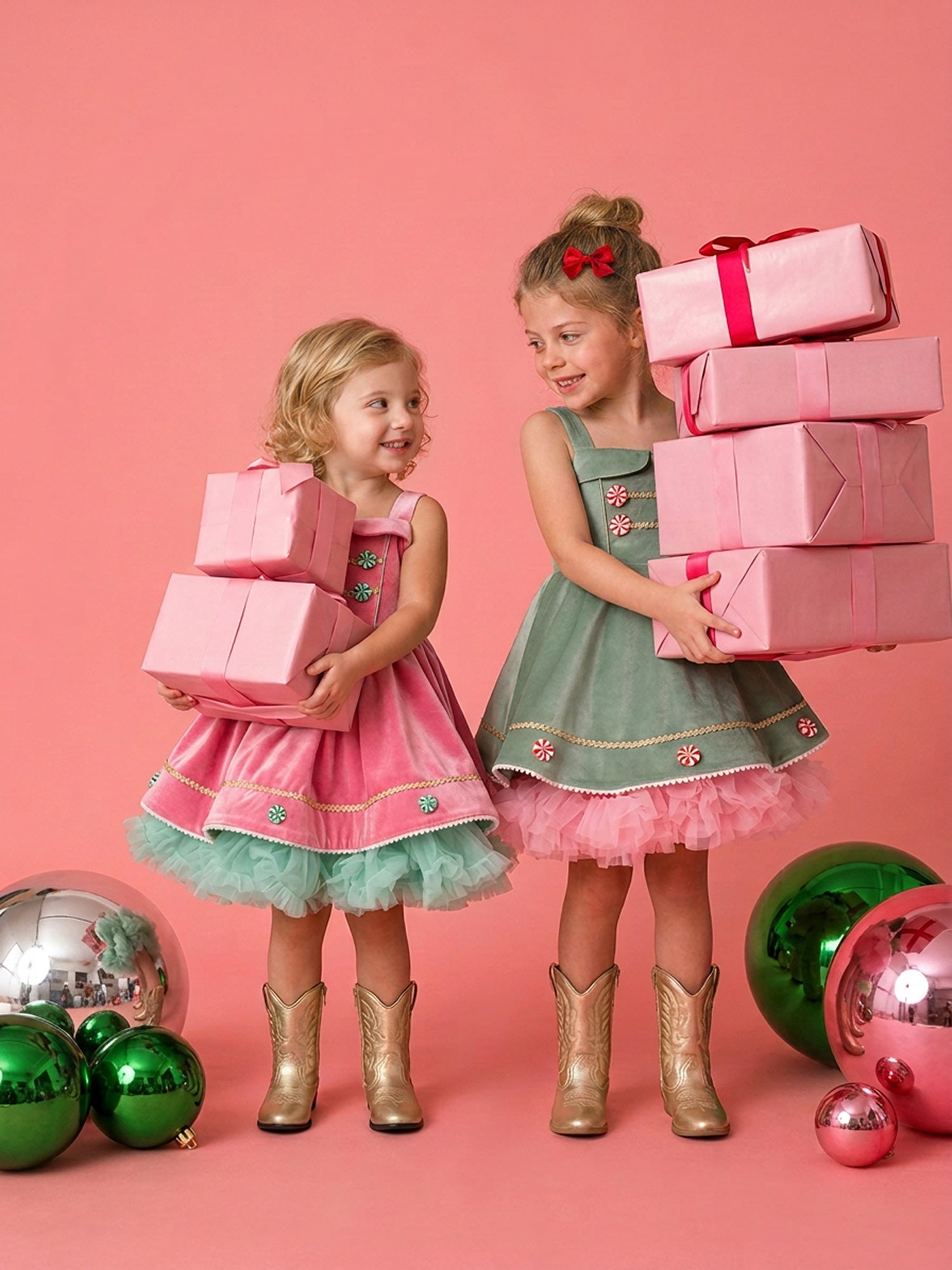 Girls wearing Merry Berry and Merry Mint matching Christmas dresses